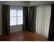 2311 South Cypress Bend Drive, Unit 416 Pompano Beach, FL 33069 - Photo 10 of 16 a view of an empty room with a window