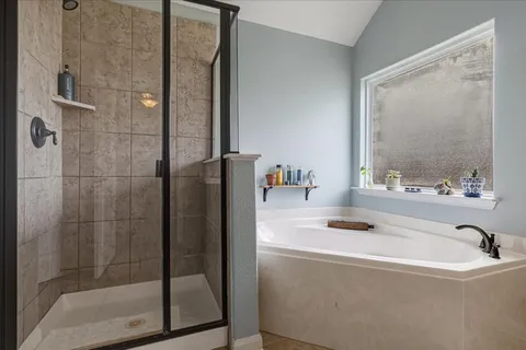 a bathroom with a tub and a sink
