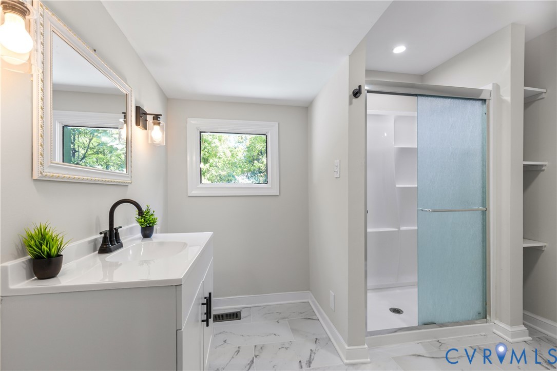 8409 Hopkins Road North Chesterfield, VA 23237 - Photo 33 of 51 Floating vanity with integrated sink, white counte