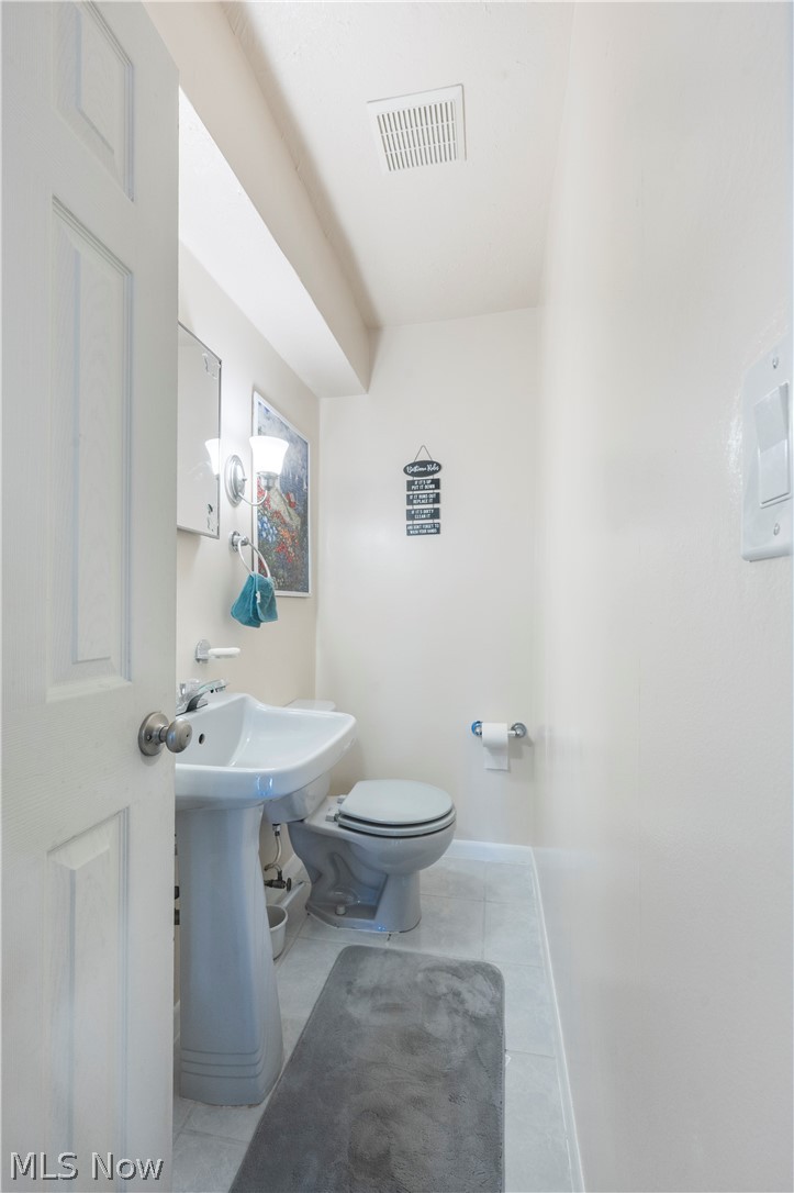 6597 York Road Parma Heights, OH 44130 - Photo 24 of 34 Bathroom with toilet and tile floors