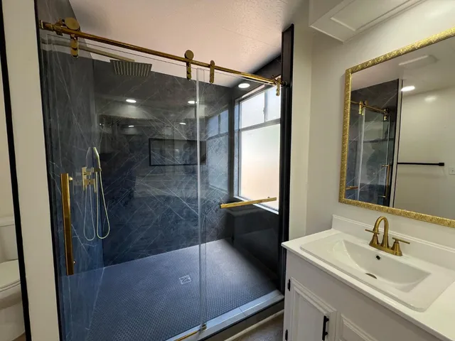 a bathroom with a sink and a mirror