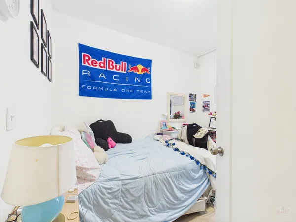 a bedroom with a bed and a table