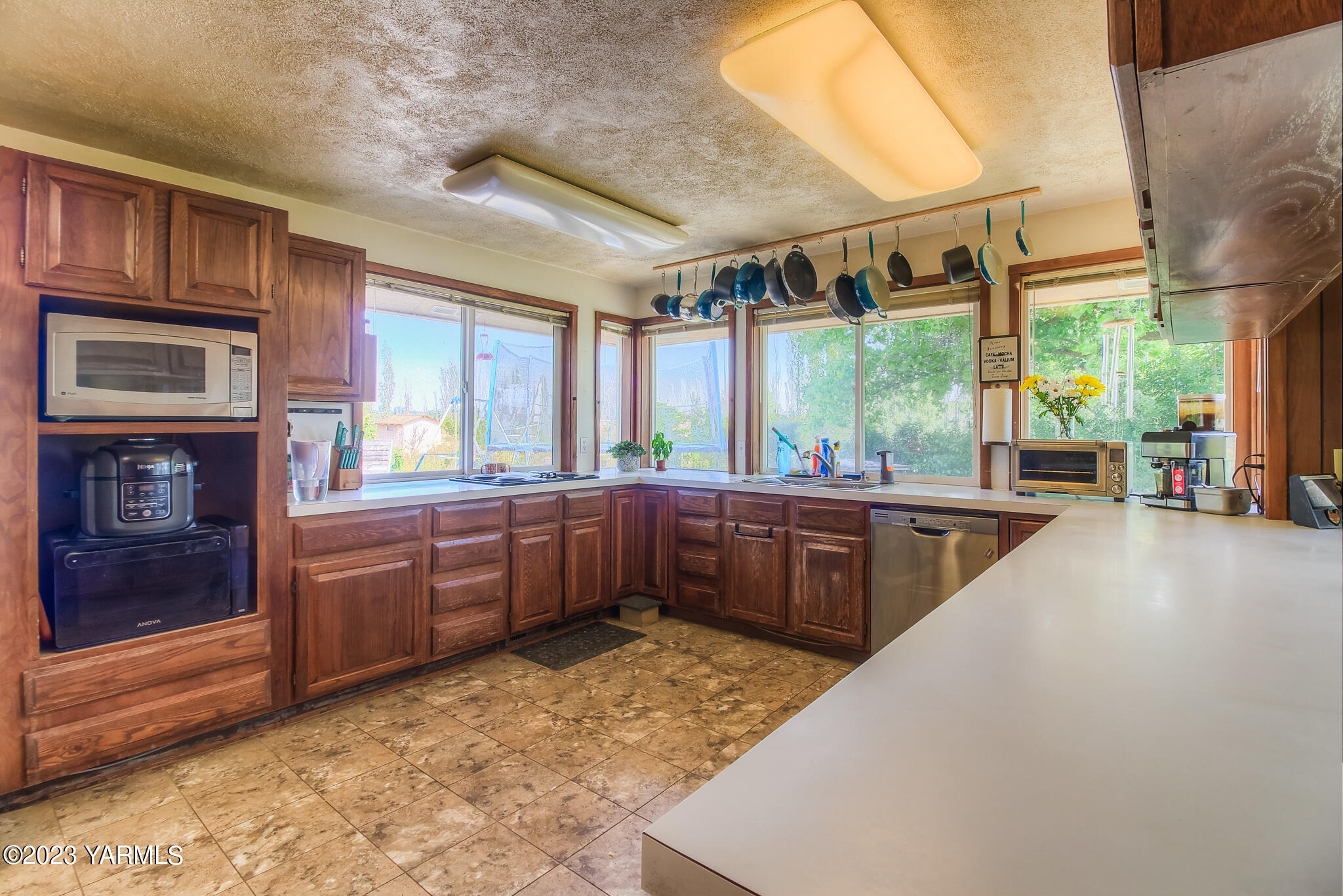 15451 Summitview Road Cowiche, WA 98923 - Photo 15 of 22 a large kitchen with kitchen island granite countertop a large window and a counter space