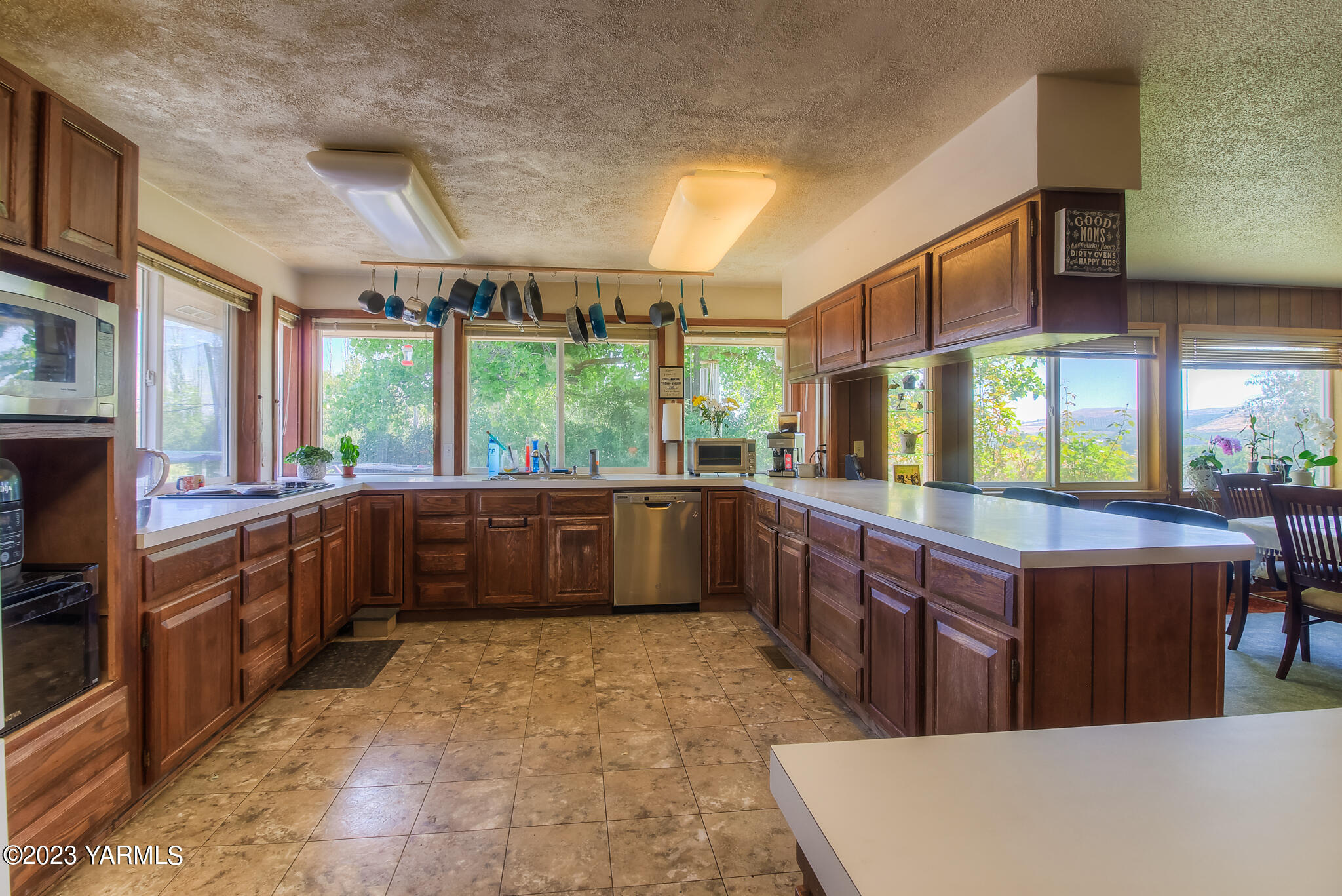15451 Summitview Road Cowiche, WA 98923 - Photo 17 of 22 a kitchen with stainless steel appliances a large counter top a stove top oven