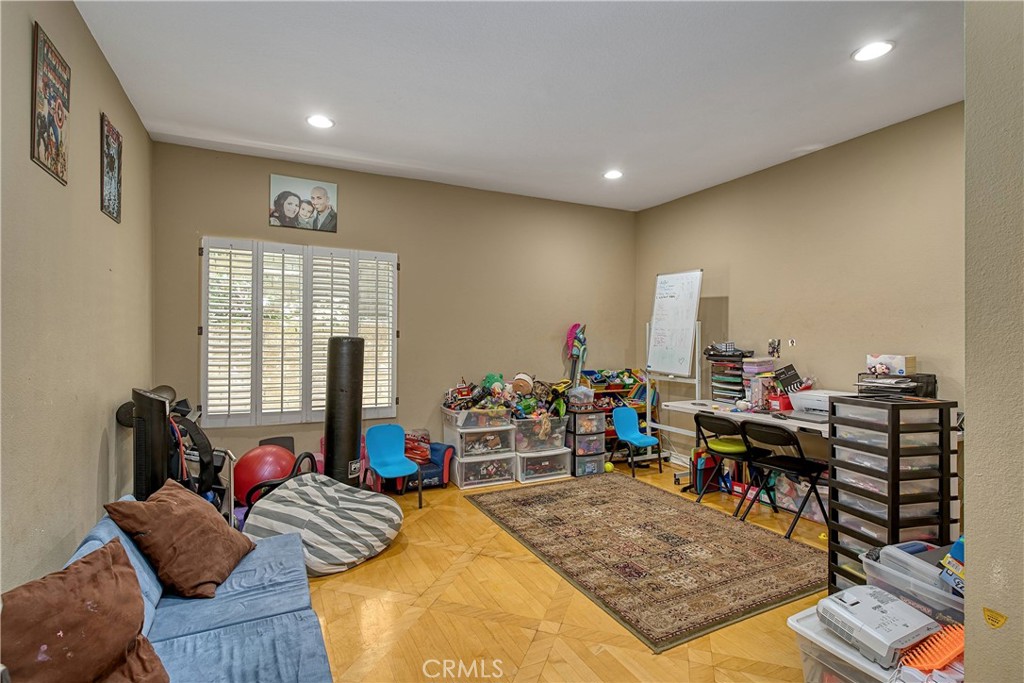 23924 Clarington Drive West Hills, CA 91304 - Photo 14 of 40 a living room with furniture and a wooden floor