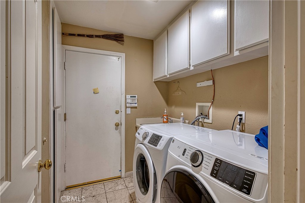 23924 Clarington Drive West Hills, CA 91304 - Photo 16 of 40 a utility room with dryer and washer