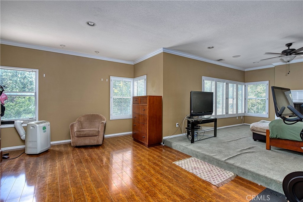 23924 Clarington Drive West Hills, CA 91304 - Photo 18 of 40 a living room with furniture and a flat screen tv