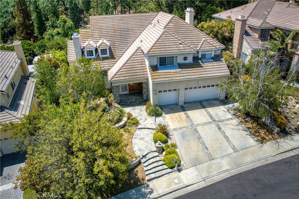 23924 Clarington Drive West Hills, CA 91304 - Photo 2 of 40 a aerial view of a house with a yard