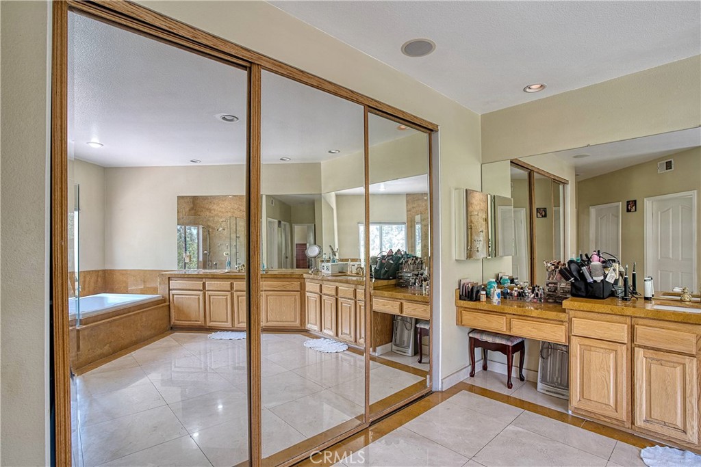 23924 Clarington Drive West Hills, CA 91304 - Photo 22 of 40 a large bathroom with a tub and sink