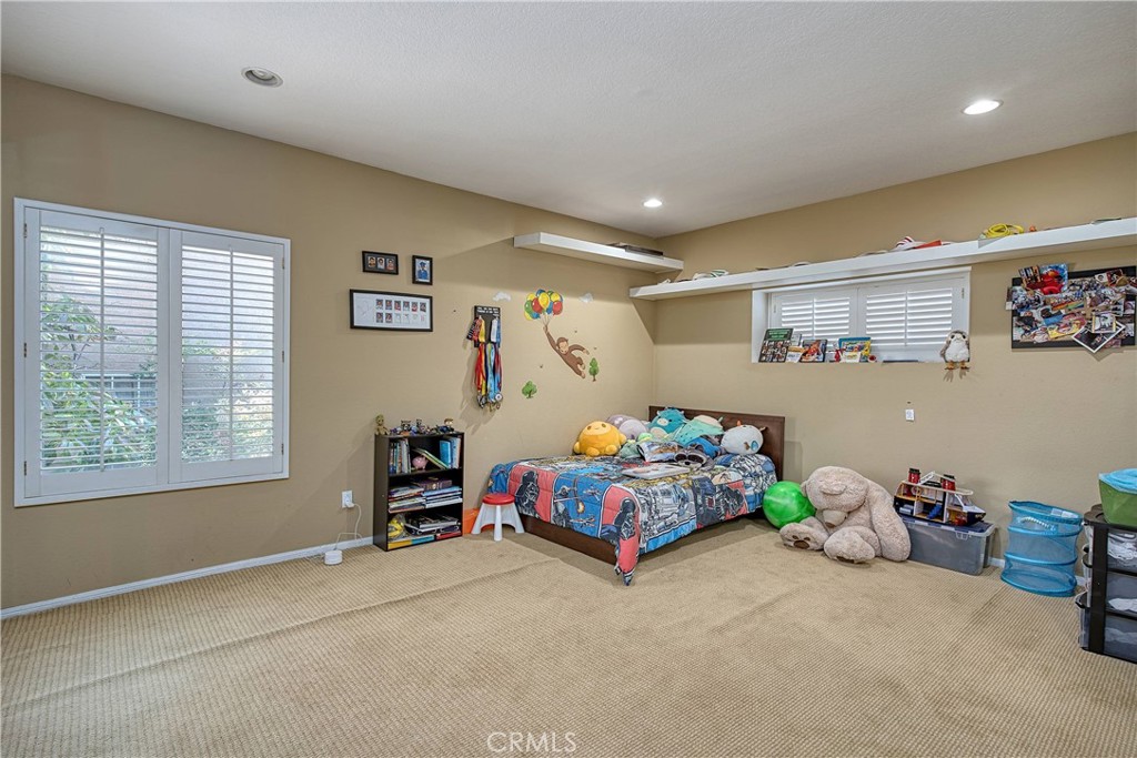 23924 Clarington Drive West Hills, CA 91304 - Photo 24 of 40 a bedroom with bed and a window