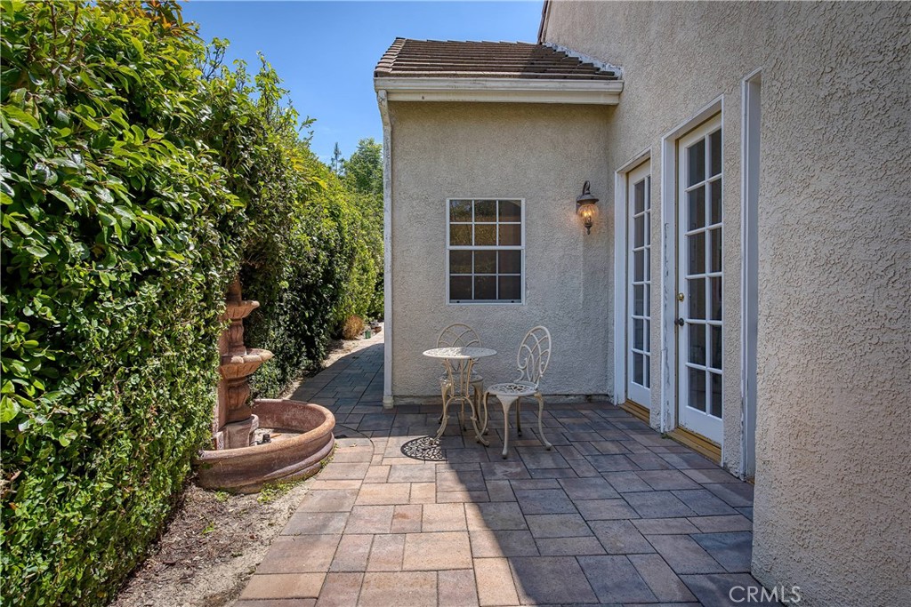 23924 Clarington Drive West Hills, CA 91304 - Photo 30 of 40 a view of a patio with table and chairs and potted plants