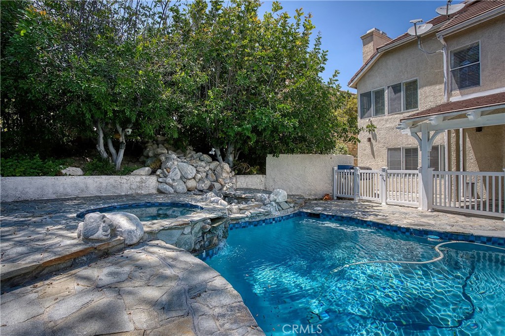23924 Clarington Drive West Hills, CA 91304 - Photo 32 of 40 a view of backyard of house with outdoor seating