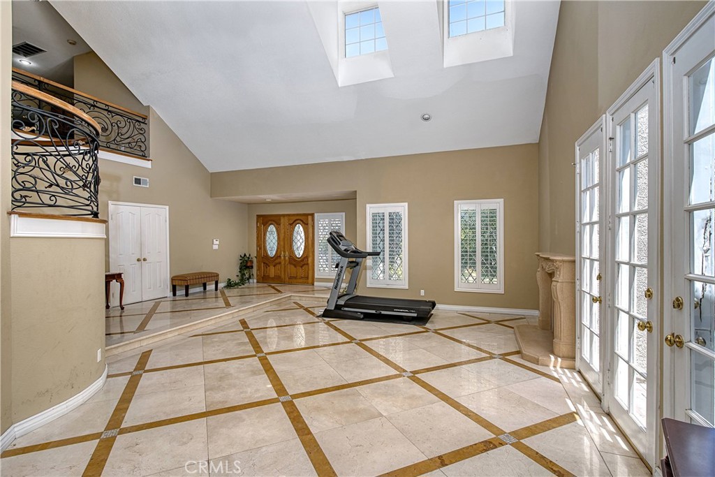 23924 Clarington Drive West Hills, CA 91304 - Photo 5 of 40 a living room with furniture and a floor to ceiling window