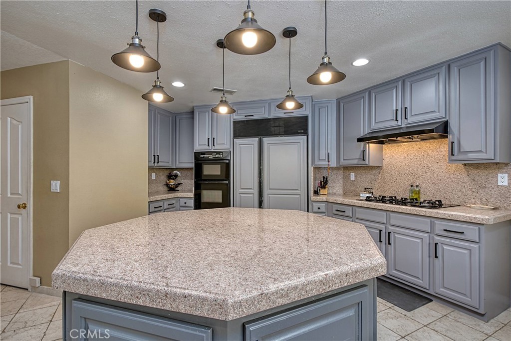 23924 Clarington Drive West Hills, CA 91304 - Photo 9 of 40 a kitchen with refrigerator and cabinets