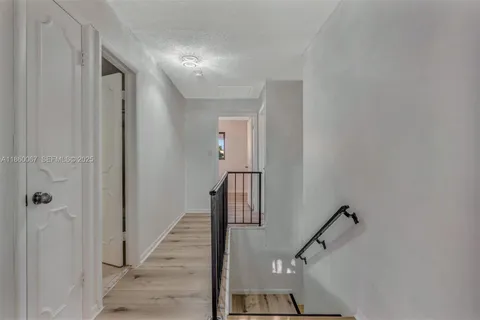 a view of a hallway with staircase