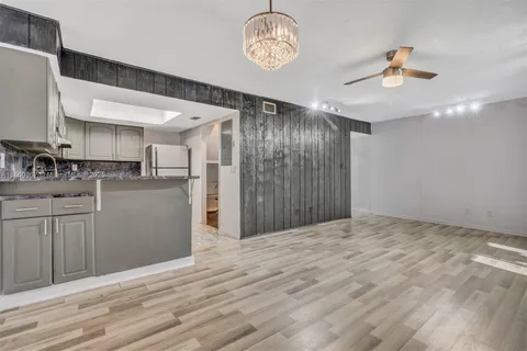 a view of a kitchen with a sink and cabinet