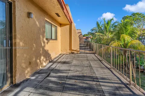 a view of a balcony with wooden floor