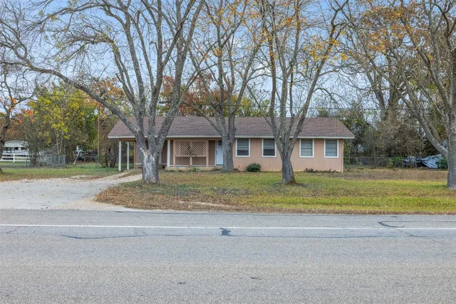 a view of outdoor space yard and front view of house