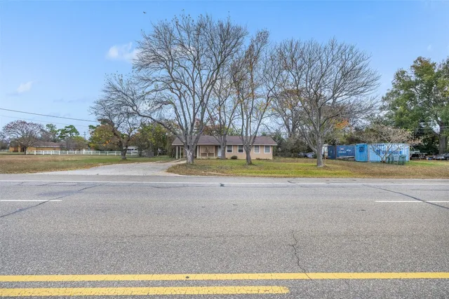 a view of park with large trees
