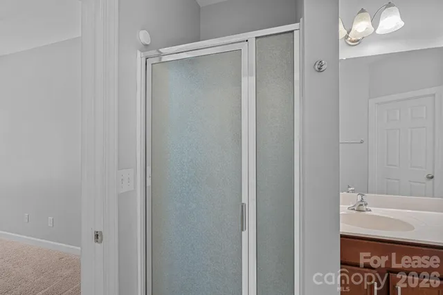 a bathroom with a sink and mirror
