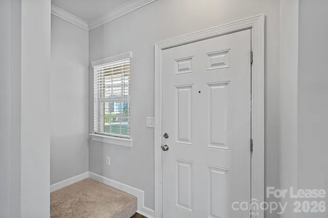 a view of an empty room with windows