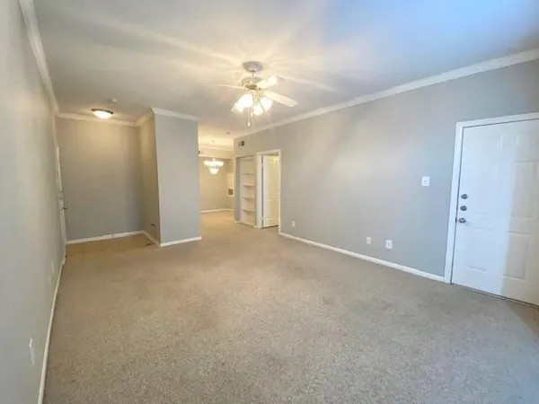 a view of an empty room with a bathroom