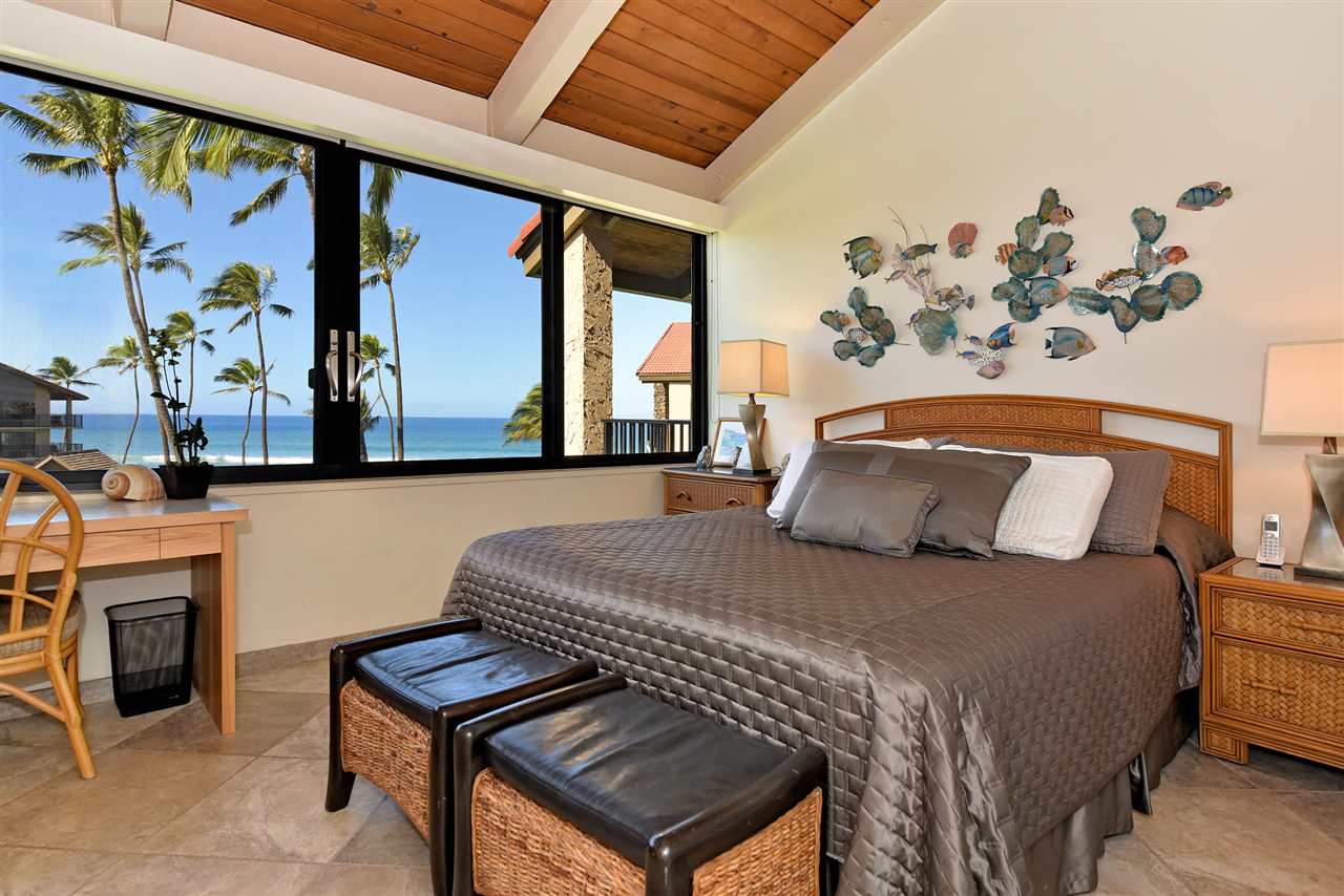 3543 Lower Honoapiilani Road, Unit B405 Lahaina, HI 96761 - Photo 11 of 30 a bedroom with a bed and a fireplace