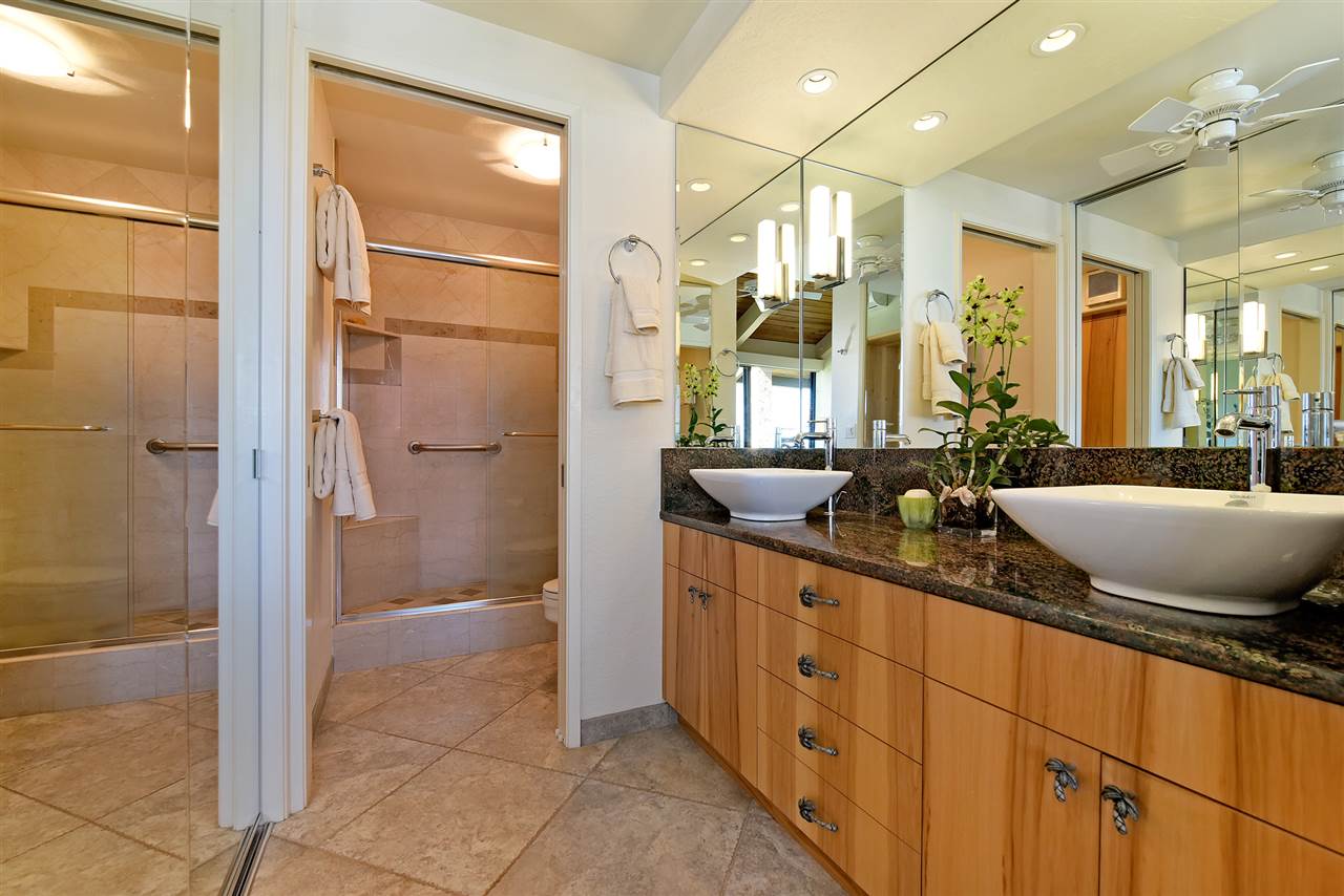 3543 Lower Honoapiilani Road, Unit B405 Lahaina, HI 96761 - Photo 15 of 30 a spacious bathroom with a double vanity sink a large mirror and shower