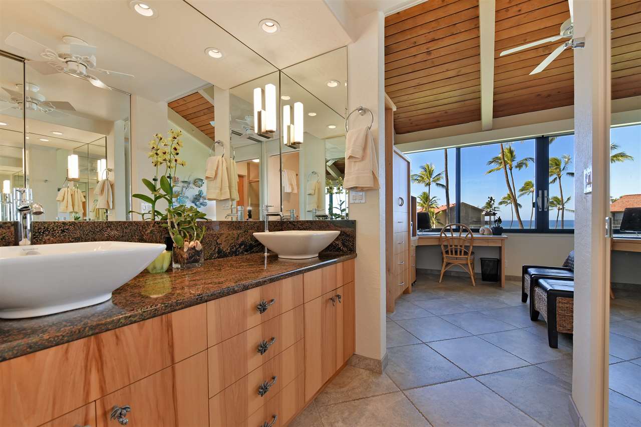 3543 Lower Honoapiilani Road, Unit B405 Lahaina, HI 96761 - Photo 16 of 30 a kitchen with a sink and cabinets