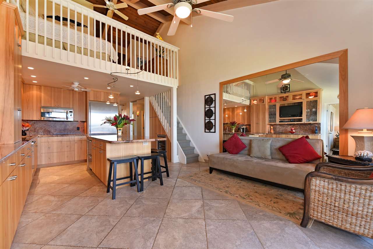 3543 Lower Honoapiilani Road, Unit B405 Lahaina, HI 96761 - Photo 19 of 30 a living room with furniture and a flat screen tv