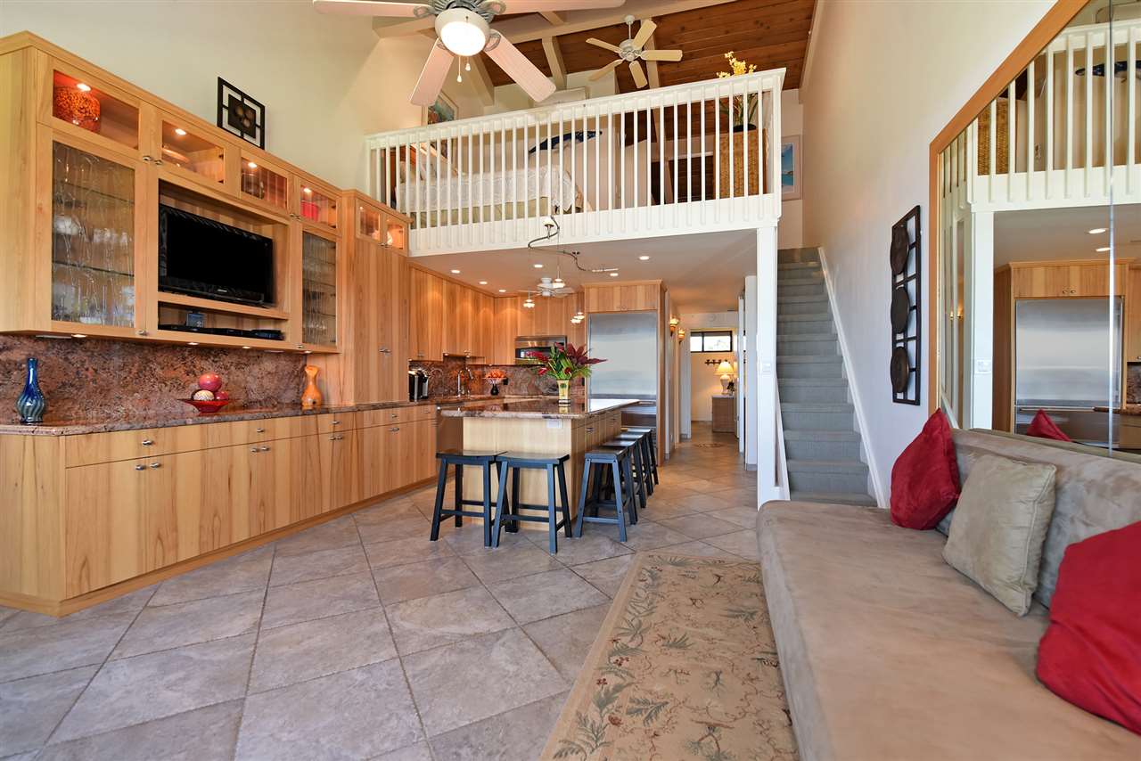 3543 Lower Honoapiilani Road, Unit B405 Lahaina, HI 96761 - Photo 20 of 30 a dining room with furniture and a flat screen tv