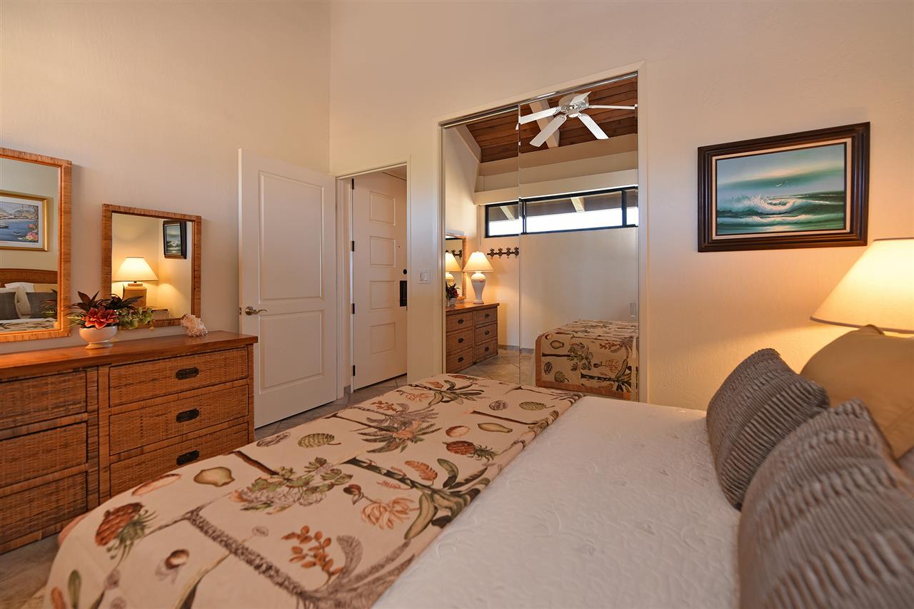 3543 Lower Honoapiilani Road, Unit B405 Lahaina, HI 96761 - Photo 25 of 30 a bedroom with a bed and a dresser