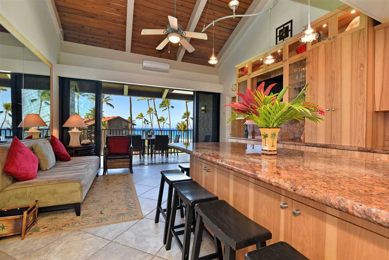 3543 Lower Honoapiilani Road, Unit B405 Lahaina, HI 96761 - Photo 3 of 30 a dining hall with furniture and a large window