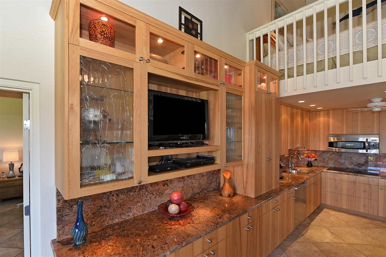 3543 Lower Honoapiilani Road, Unit B405 Lahaina, HI 96761 - Photo 7 of 30 a kitchen with stainless steel appliances a stove a sink and a refrigerator