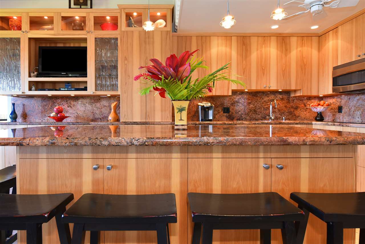 3543 Lower Honoapiilani Road, Unit B405 Lahaina, HI 96761 - Photo 9 of 30 a kitchen with a table and chairs in it
