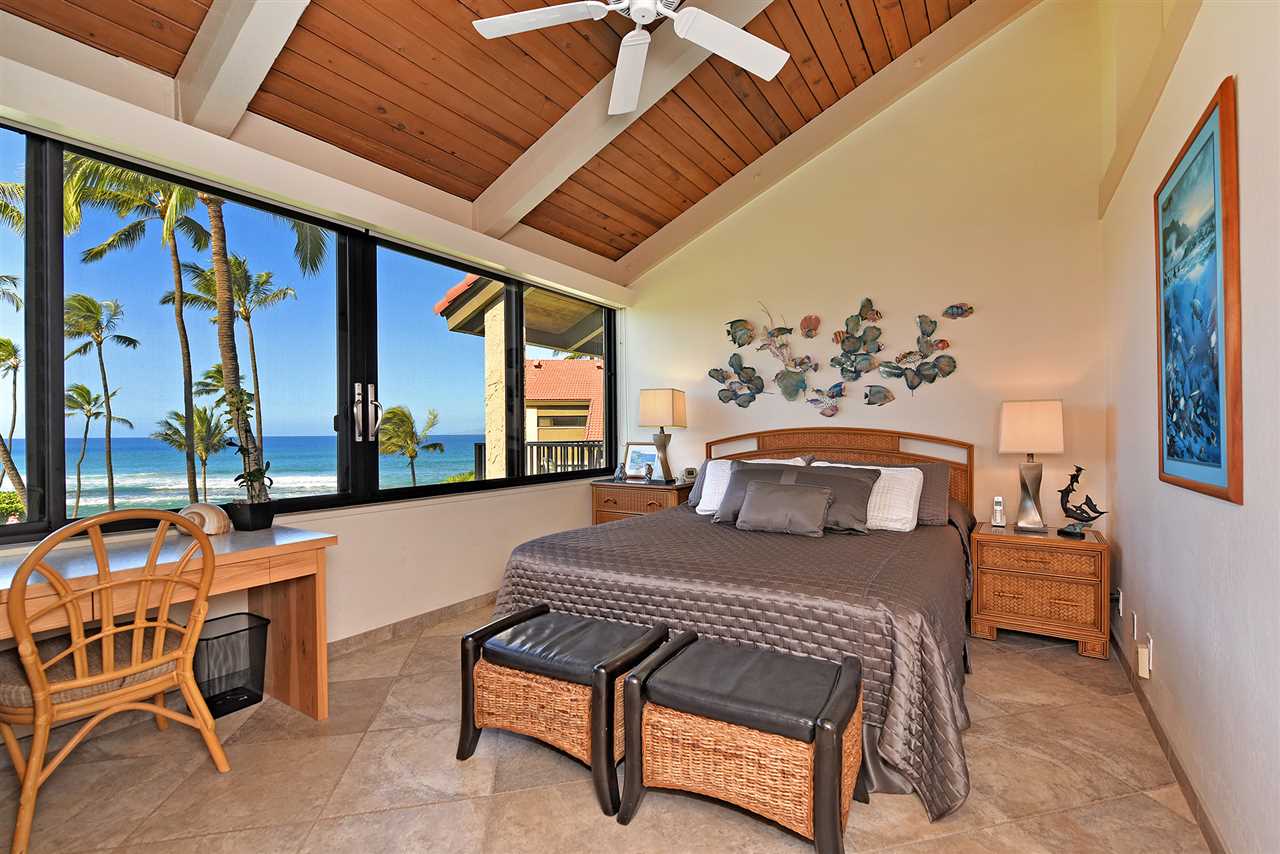 3543 Lower Honoapiilani Road, Unit B405 Lahaina, HI 96761 - Photo 10 of 30 a bedroom with furniture and a large window