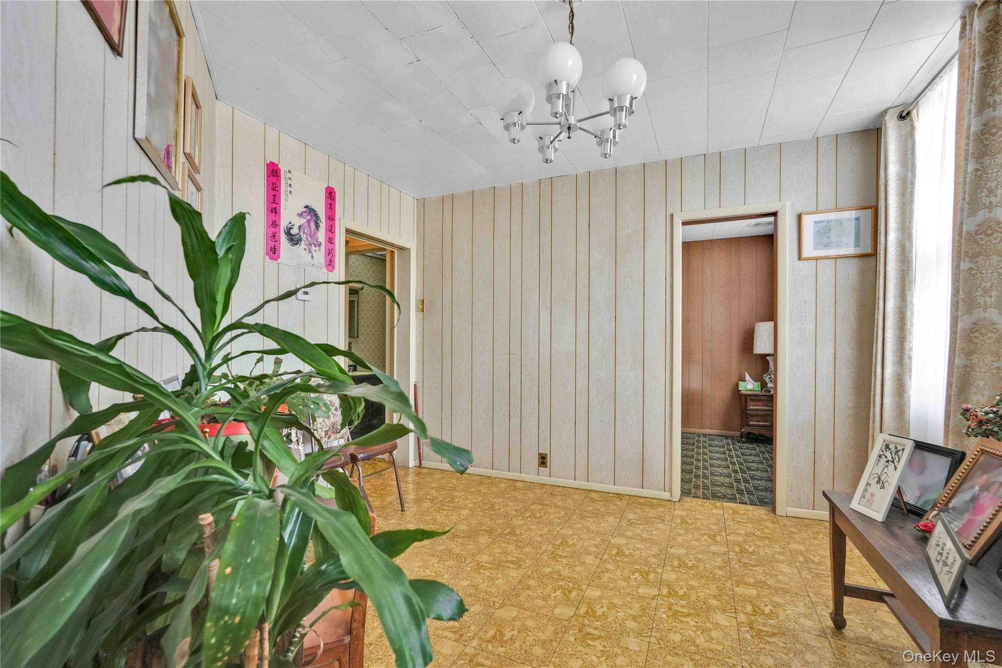 42-01 Newtown Road Queens, NY 11103 - Photo 16 of 27 a view of an entryway with wooden floor