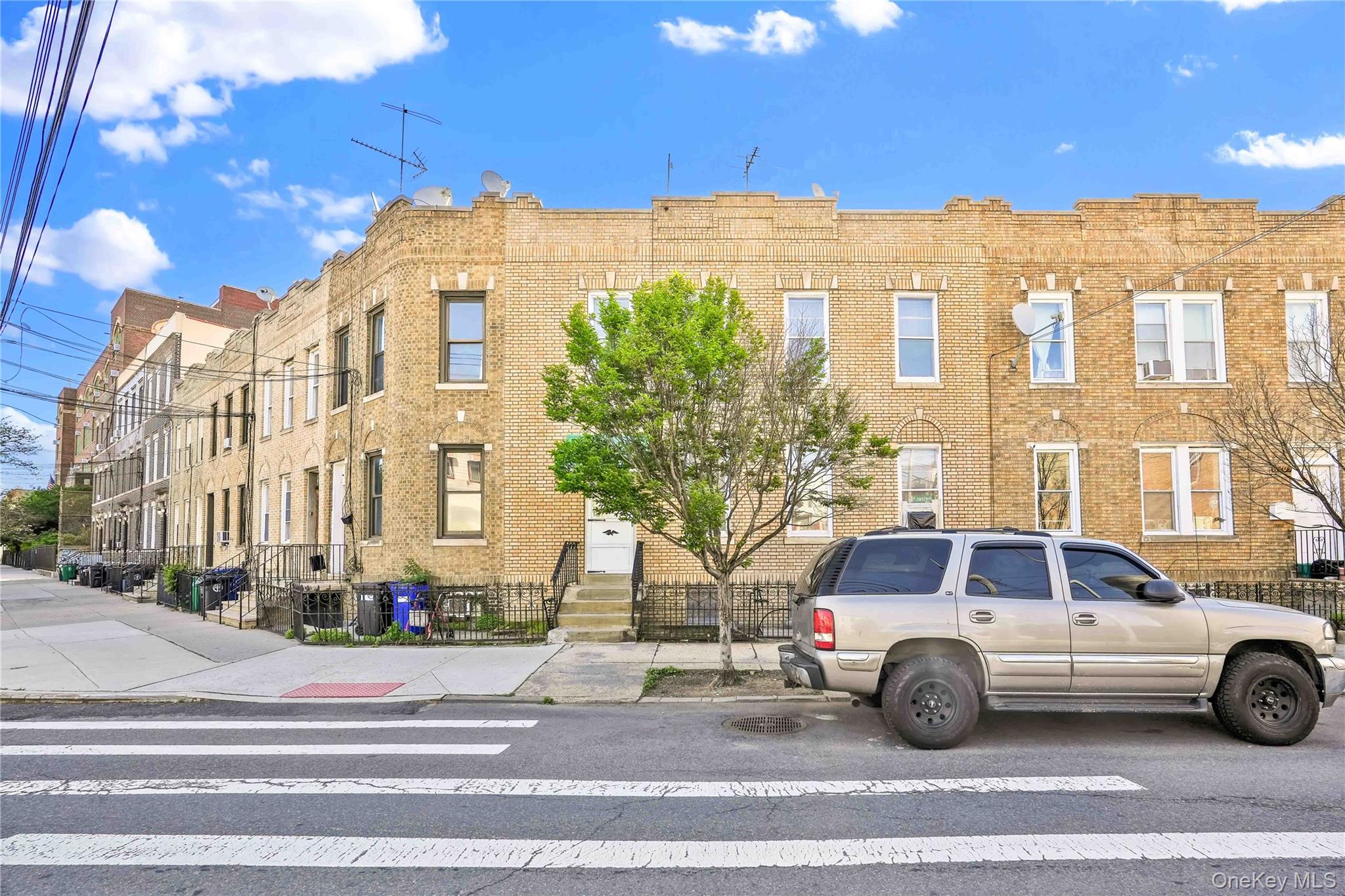 42-01 Newtown Road Queens, NY 11103 - Photo 2 of 27 a view of a building and car parked