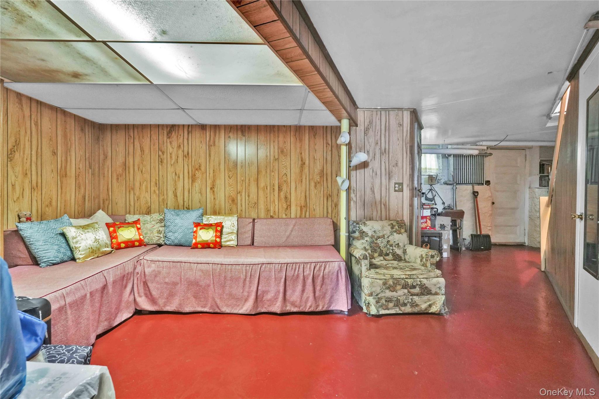 42-01 Newtown Road Queens, NY 11103 - Photo 25 of 27 a bedroom with a bed and a couch