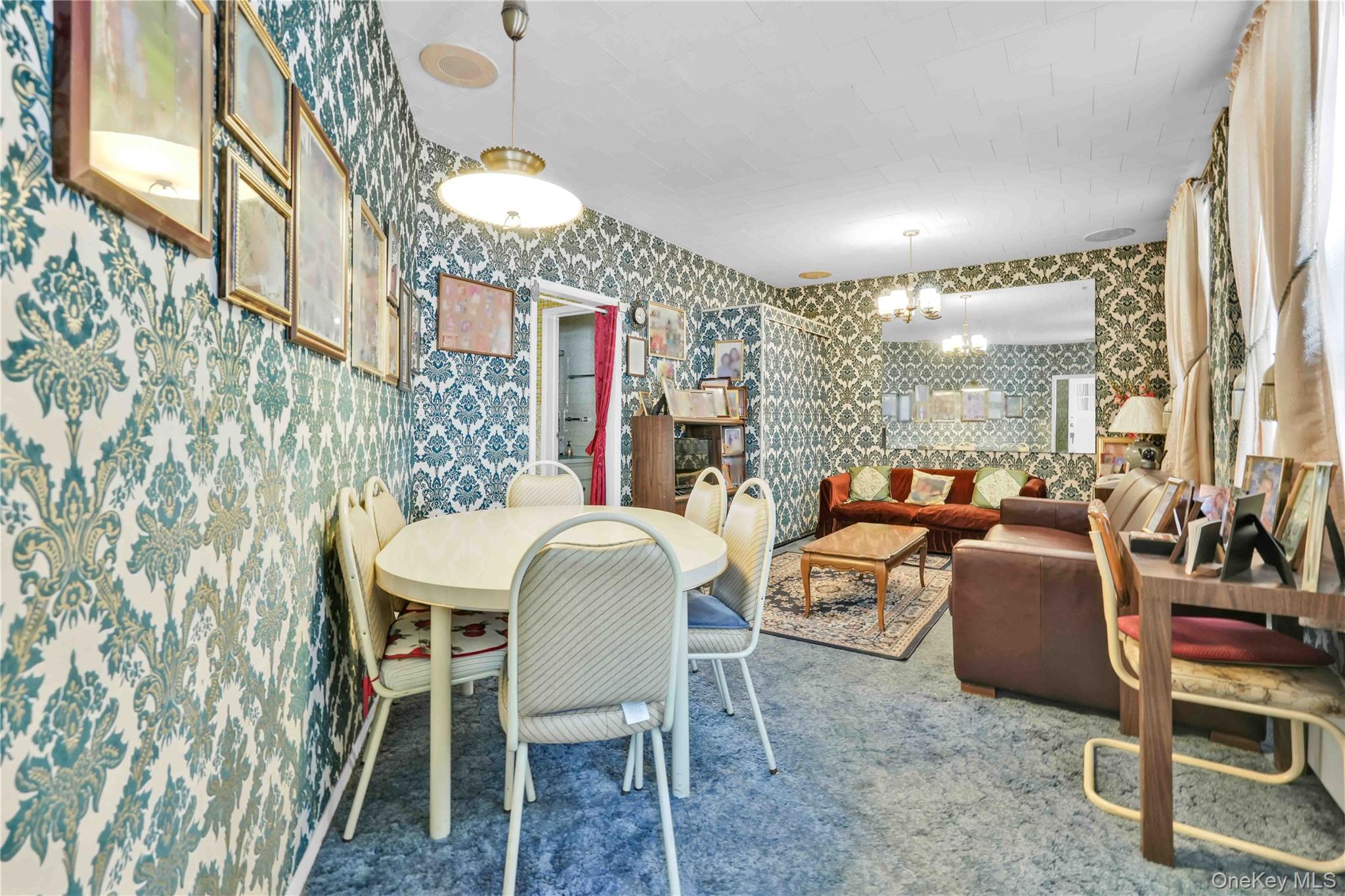 42-01 Newtown Road Queens, NY 11103 - Photo 5 of 27 a dining room with furniture and chandelier kitchen view