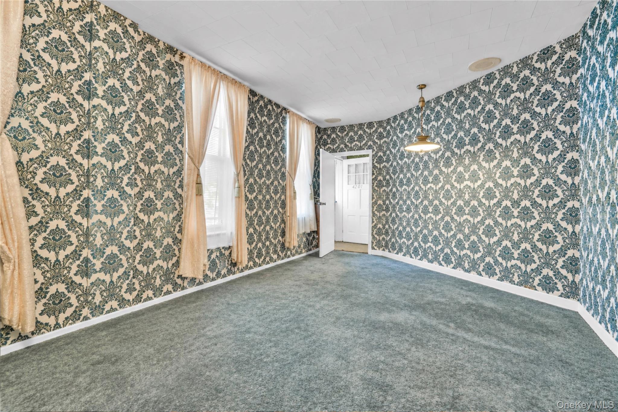 42-01 Newtown Road Queens, NY 11103 - Photo 6 of 27 a view of entryway with wooden floor