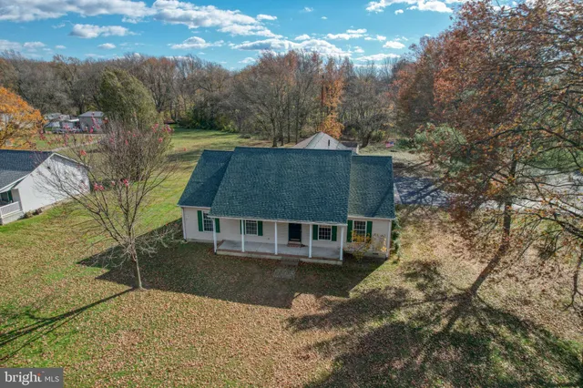 a aerial view of a house with a yard