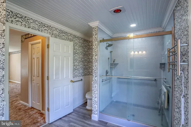 a bathroom with a glass shower door