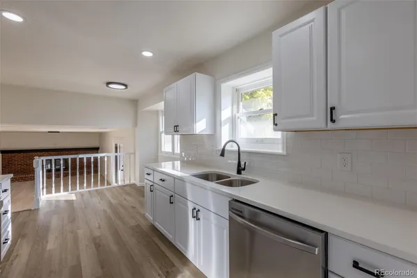 a kitchen with sink cabinets and window