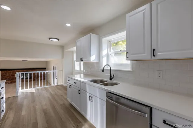 a kitchen with sink cabinets and window