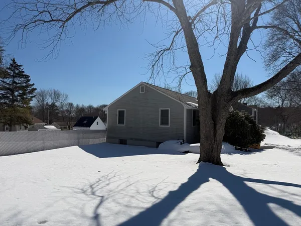 a view of a house with a snow in the yard