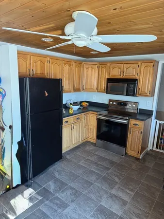 a kitchen with a cabinets and a stove