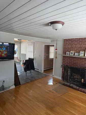 a view of a livingroom with furniture and a fireplace