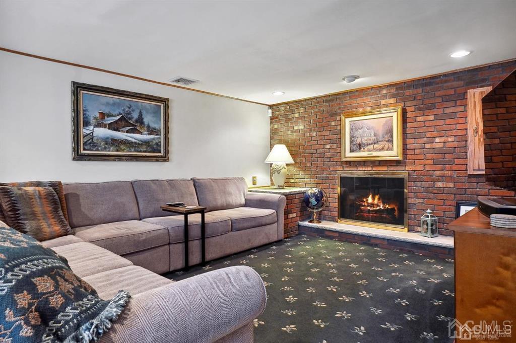 8 Tamarack Road Edison, NJ 08820 - Photo 11 of 31 a living room with furniture and a fireplace