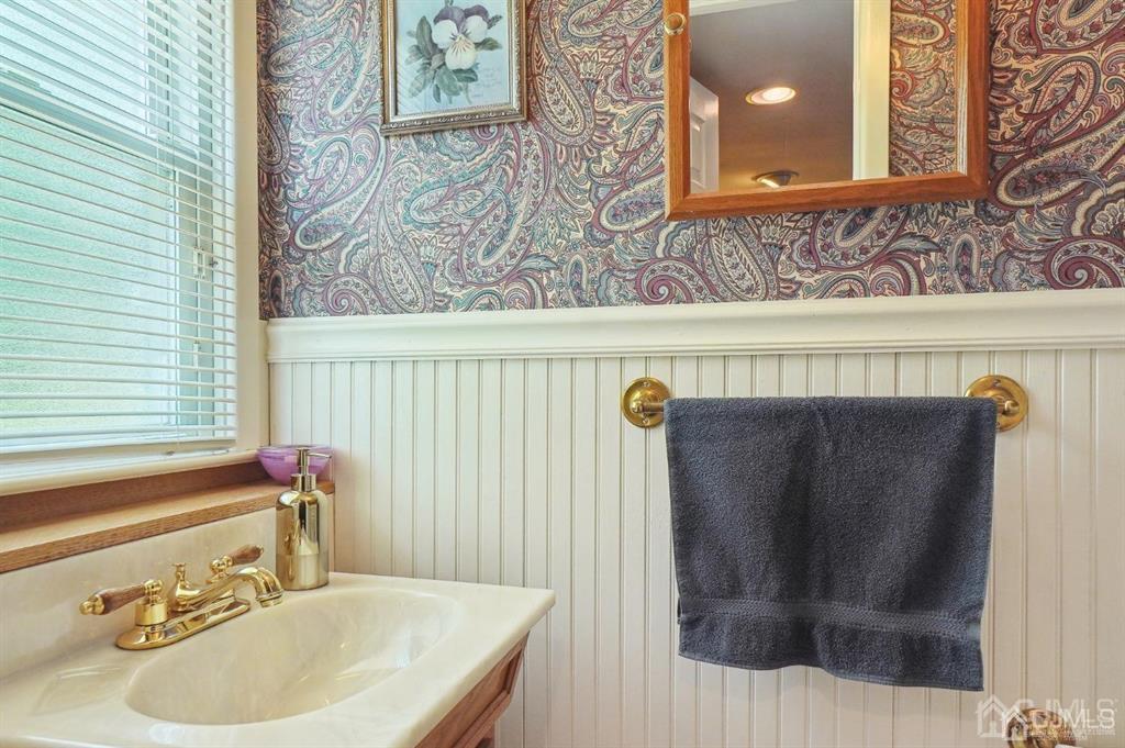 8 Tamarack Road Edison, NJ 08820 - Photo 12 of 31 a bathroom with a sink and a mirror